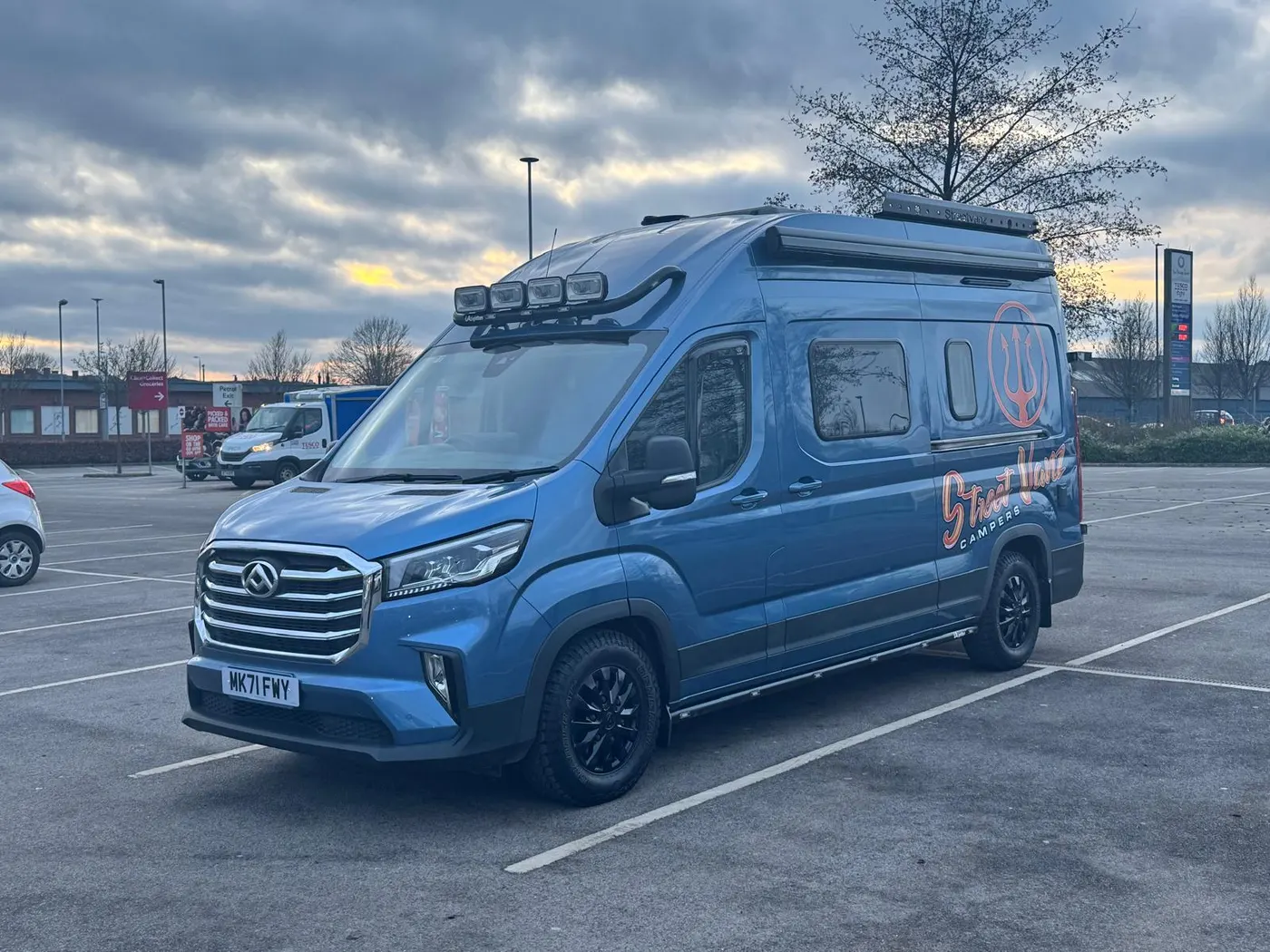 Blue StreetVanz campervan photographed outside the workshop